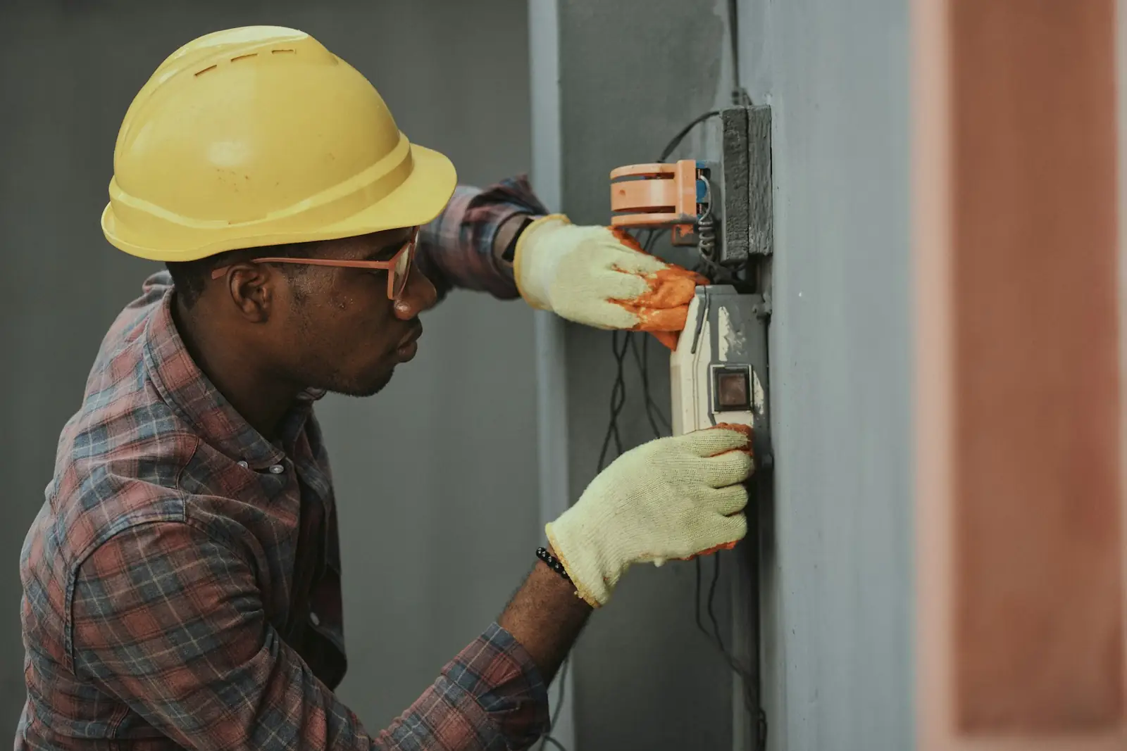 Electrician testing a circuit with a multimeter
